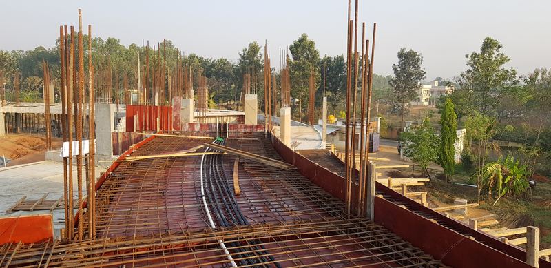 Reinforcement for the upper slab following the building's curve, early morning