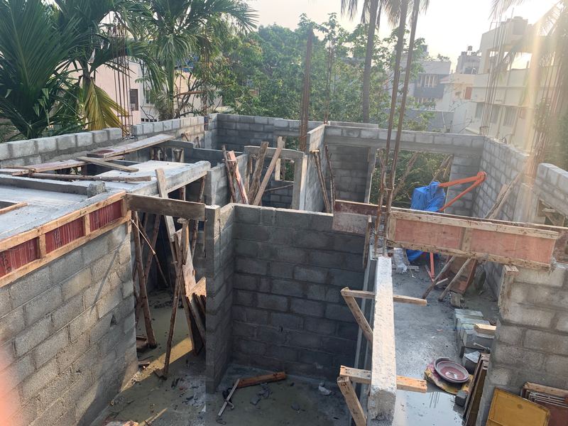 Concrete-block walls and formwork on an upper floor of a house under construction