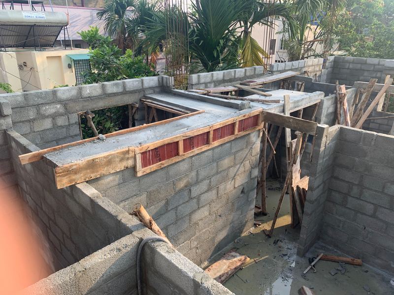Lintel formwork boards set on top of new concrete-block walls