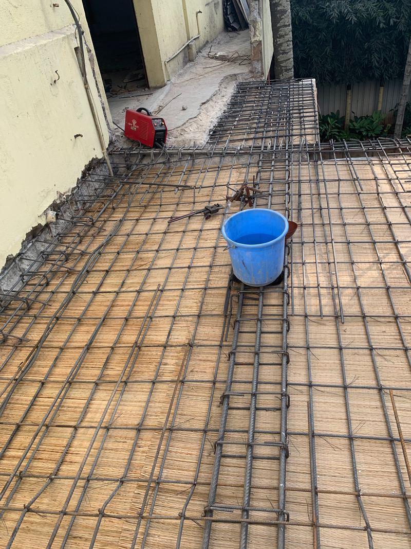Reinforcement mesh and beam bars laid over the slab formwork